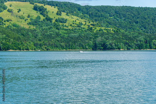 Lake Izvorul Muntelui on a sunny day, Lake Bicaz, Piatra Neamt, Romania photo