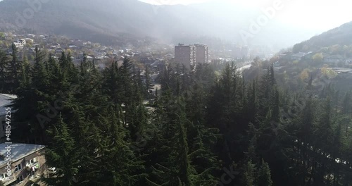 Aerial Drone Footage View: Flying from the forest over spring mountains, hills and meadows with pine forests in sun soft light. Beautiful landscape.  4K Ultra HD. Dilijan