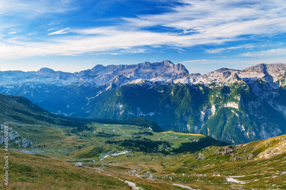 Plateau in Julian Alps in Italy and mountainous range in the background