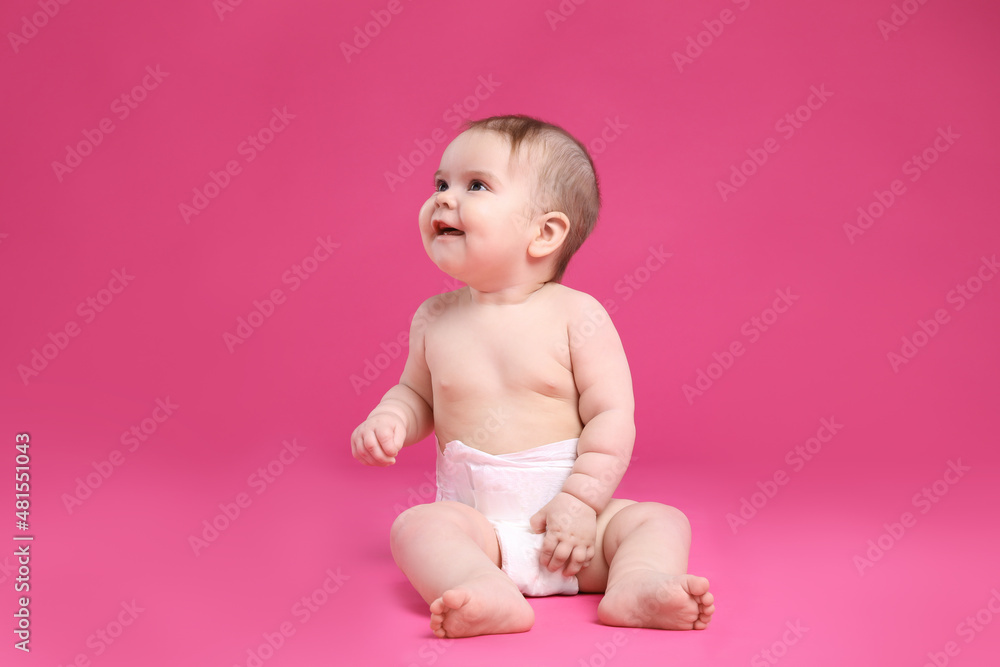 Cute little baby in diaper sitting on pink background Cute little baby in diaper sitting on pink background