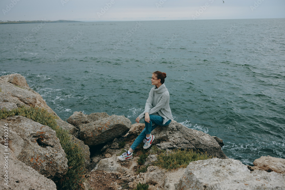 beautiful woman sweaters cloudy sea admiring nature Relaxation concept