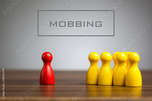 Mobbing word headline with toy figurines