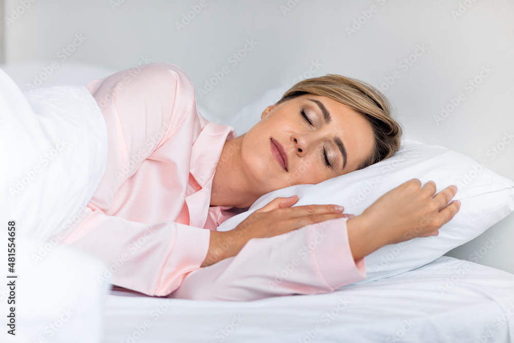 Beautiful mature woman sleeping well on the side Beautiful mature woman sleeping well on the side