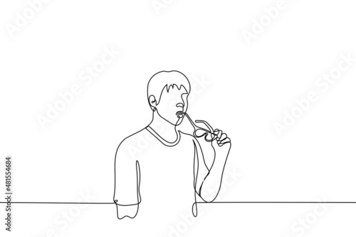 man standing biting frame of his glasses - one line drawing vector. man surprised, fascinated or thoughtful