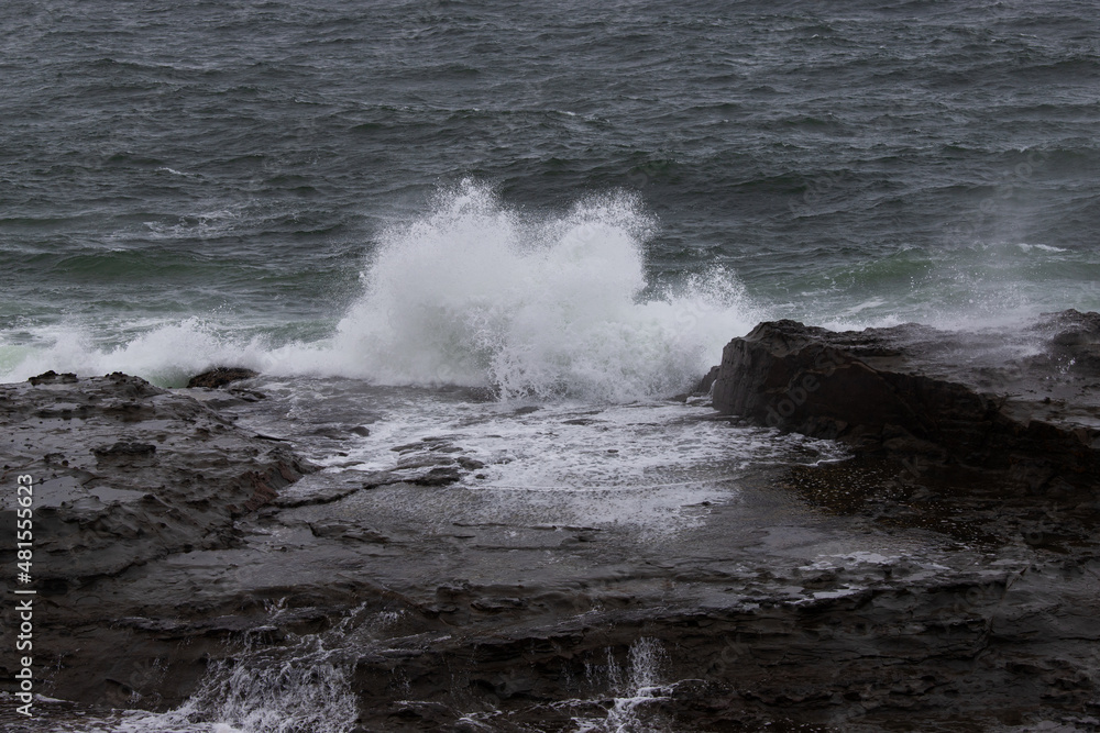 Wave breaking on the rocky coastline. Wave breaking on the rocky coastline.