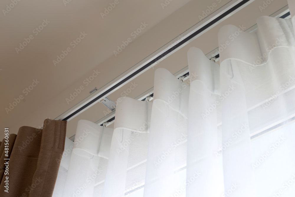 Obraz premium Curtains door or window, Curtain rail with white and brown curtain