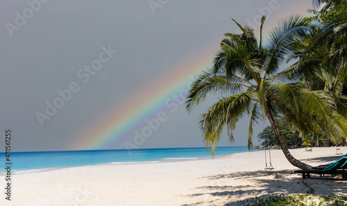 Fototapeta Naklejka Na Ścianę i Meble -  Calm sea before storm with amazing rainbow after the rain -sand beach background
