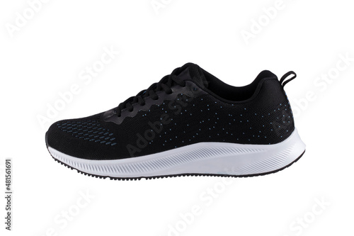 Black sneaker made of fabric with a white sole on a white background. Sport shoes.