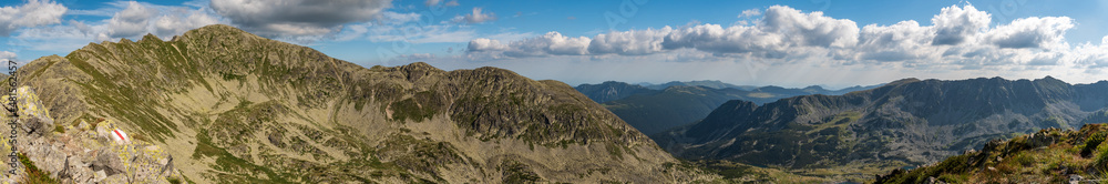 View from Custura Bucurei mountain peak summit in Retezat mountains in Romania