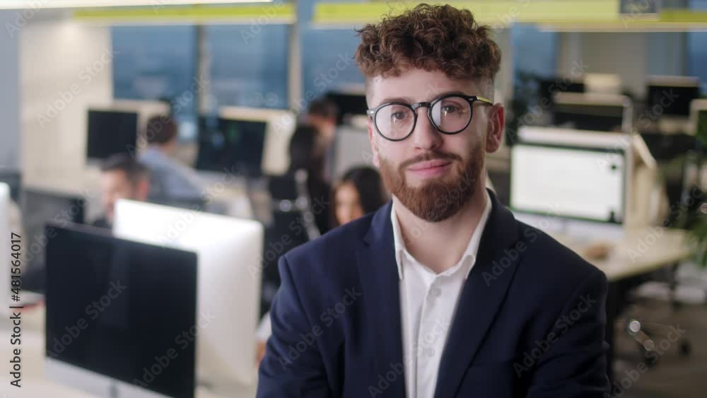 Close Up Portrait of Young Male Team Leader in in Jacket and Glasses With Smiling Face Posing in Office, Confident Business Executive Ceo Looking at Camera, Company Employee, Professional Manager Close Up Portrait of Young Male Team Leader in in Jacket and Glasses With Smiling Face Posing in Office, Confident Business Executive Ceo Looking at Camera, Company Employee, Professional Manager