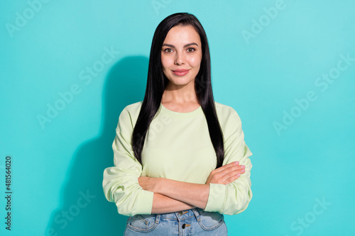 Photo of glad lovely lady cross arms enjoy doing business freelance isolated over cyan color background