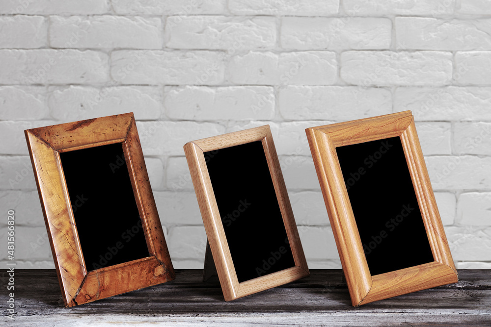 Fototapeta premium old photo frame on the wooden table
