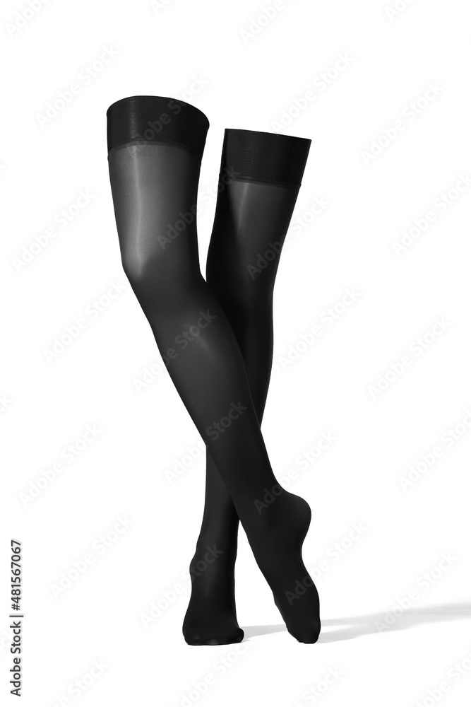 Detailed shot of black woman's stockings. The nylon stockings have a shape of woman's legs. The black woman's stockings are isolated on a white background. Detailed shot of black woman's stockings. The nylon stockings have a shape of woman's legs. The black woman's stockings are isolated on a white background.