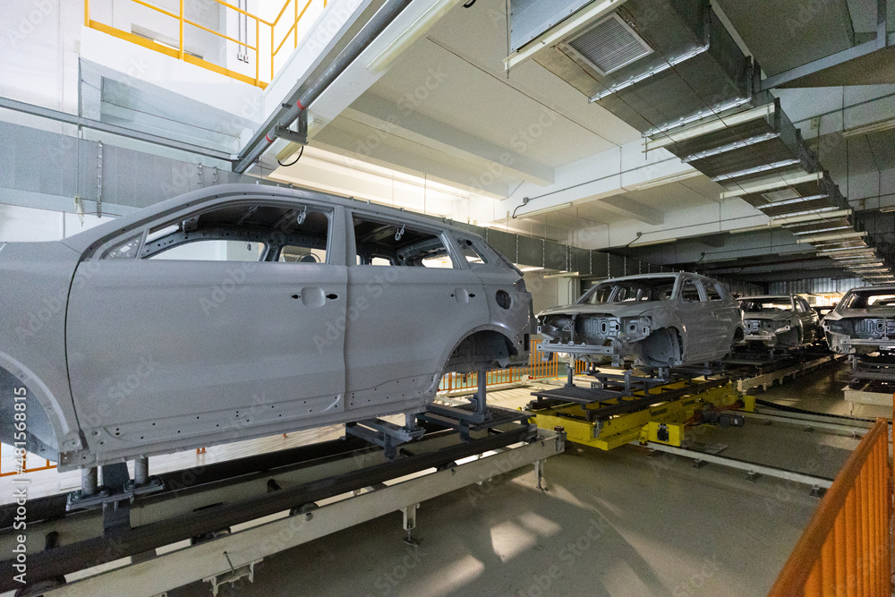 Car bodies are on assembly line. Modern automotive industry. Automobile conveyor Car bodies are on assembly line. Modern automotive industry. Automobile conveyor