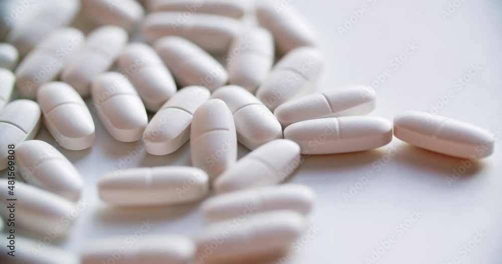 Pile Of White Tablets On White Background Pile Of White Tablets On White Background