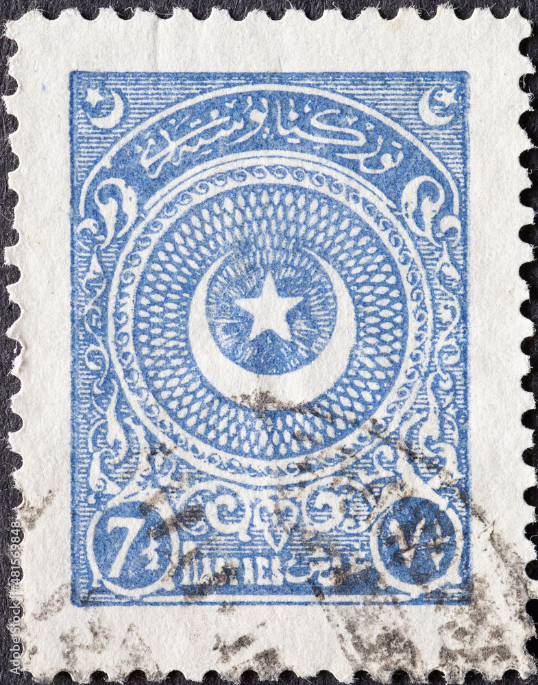 Turkey - circa 1923: a postage stamp from Turkey , showing the symbol of the Ottoman Empire. Crescent and Star