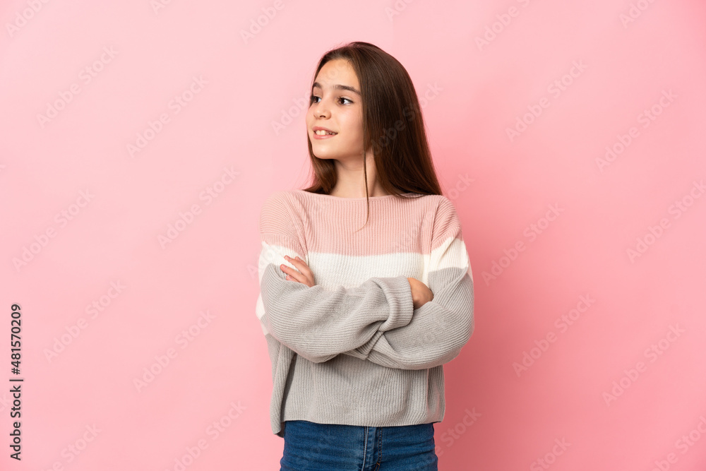 Little girl isolated on pink background looking to the side Little girl isolated on pink background looking to the side