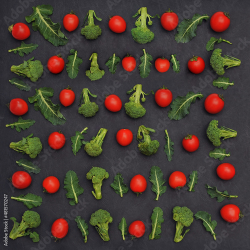 Set from fresh broccoli and cherry tomatoes on black background. Fresh vegetables,healthy food. Flat  lay top view
