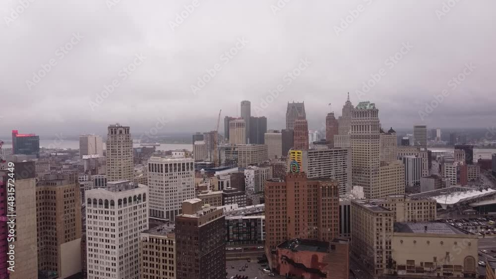 City skyline with majestic skyscrapers in Detroit, high altitude aerial shot on moody day City skyline with majestic skyscrapers in Detroit, high altitude aerial shot on moody day