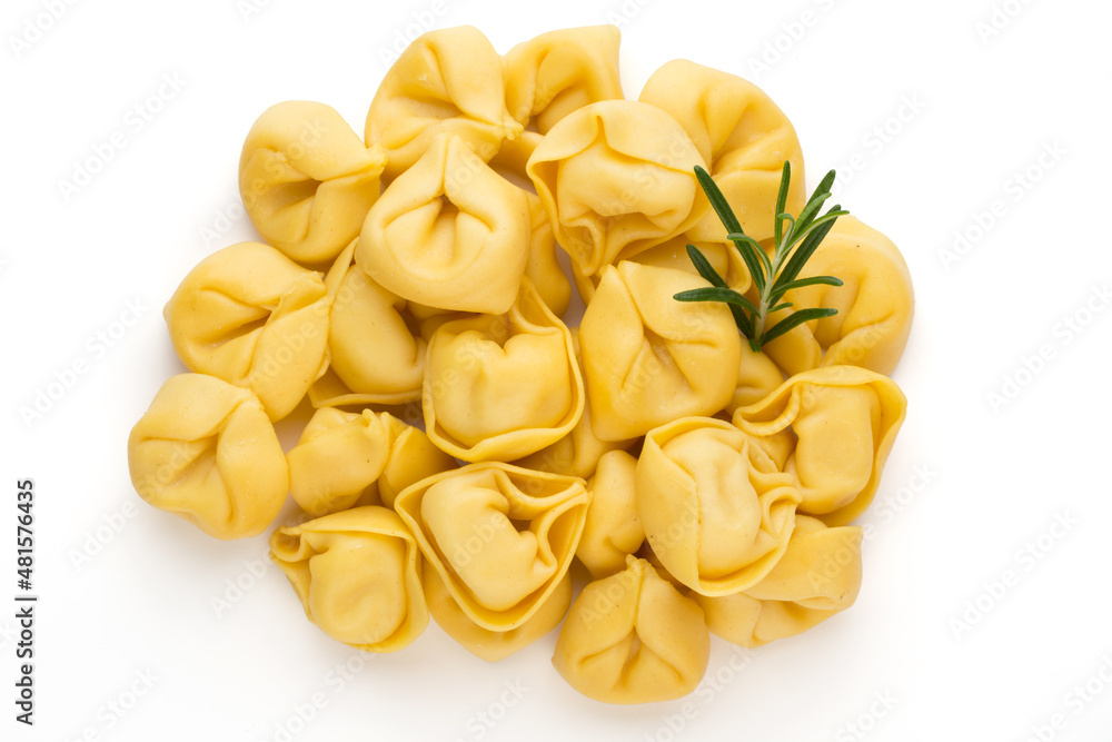 Raw homemade pasta,tortellini with herbs.