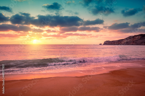 Sunset over the sea. Atlantic ocean in evening, Nazare city, Portugal