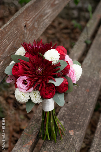 Wedding bouquet . The bride's bouquet. Bouquet of red flowers. Bridal douquet composed of dahlia and roses. photo