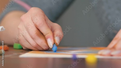 Dirty fingers of an artist. The use of chalk in painting. Technique of rubbing paint with a finger, making a gradient.