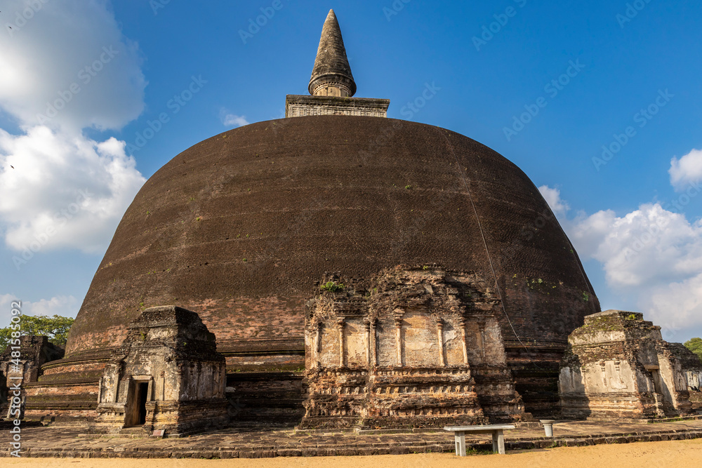 Sri Lanka. The ancient city of Polonnaruwa. Rankoth Vehera Stupa. Taken close-up on a sunny day with a clear blue sky. Sri Lanka. The ancient city of Polonnaruwa. Rankoth Vehera Stupa. Taken close-up on a sunny day with a clear blue sky.