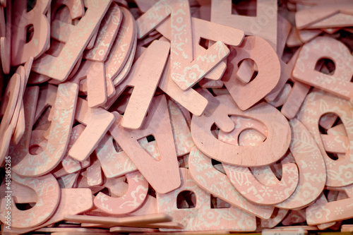 Full frame shot of cut out letters made of wooden material