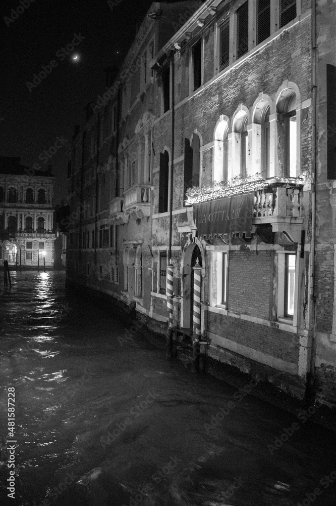 Venice, Italy, January 28, 2020, facade of a typical Venetian palace at night
