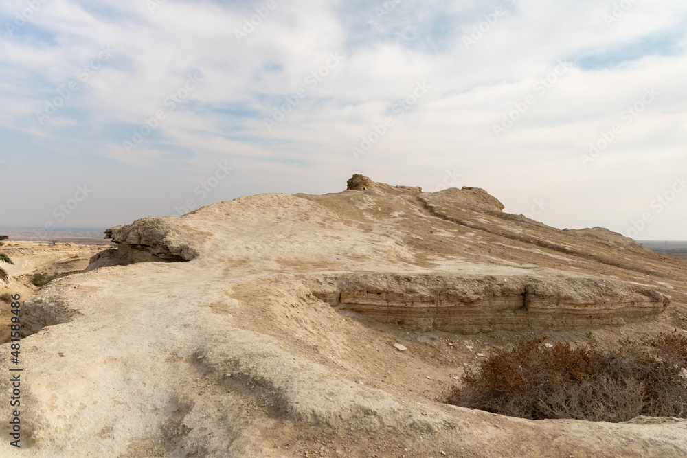 The hill  in which the caves of the hermits are located near the Deir Hijleh Monastery - Monastery of Gerasim of Jordan in the Judean Desert in Israel