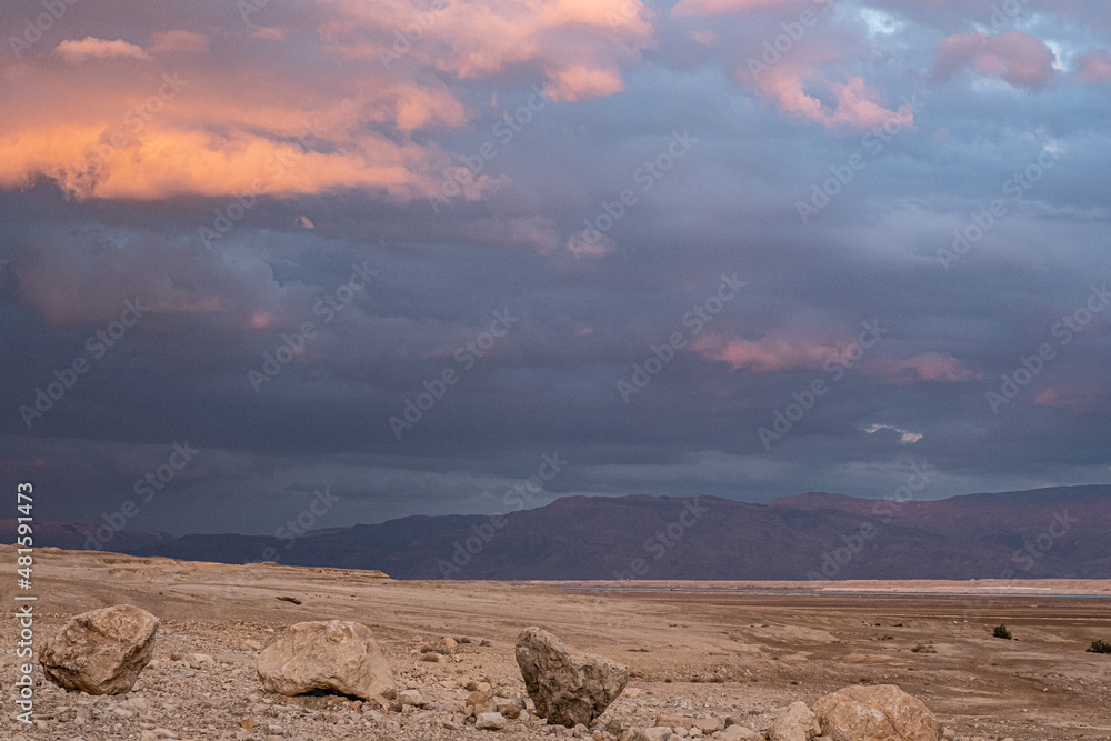 Golden sunset hours view, as seen from the Dead Sea western coastline when looking eastbound, towards the Kingdom of Jordan, Dead Sea, Judean desert, Israel.