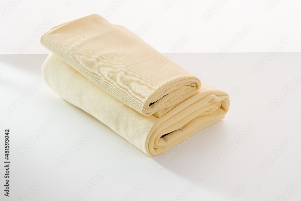 Rolls of bright colored fabric on a white background. Rolls of bright colored fabric on a white background.