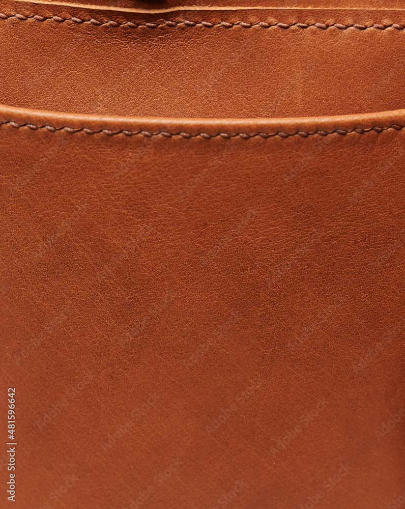 Fototapeta premium Brown leather background with stitches