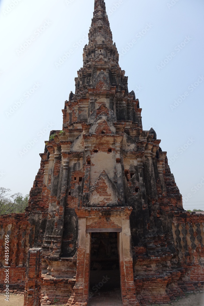 Exploring red brick Wat Chai Watthanaram temple, Ayutthaya, Thailand (vertical image)