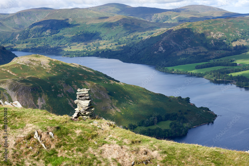 Views of Ullswater with the summits of Hallin Fell on the left, Green Hill on the right and Great Dodd in the distance from the summit of Bonscale Pike in the English Lake District, England, UK.