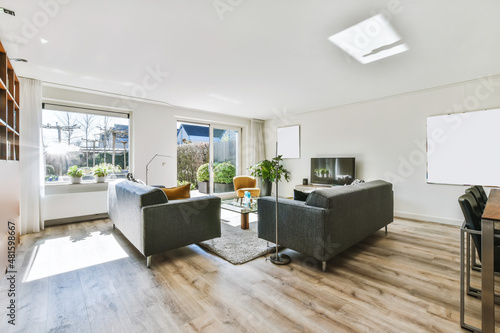 Stunning living room in daylight with wooden floor