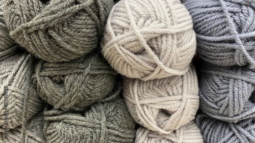 Grey of wool yarn. Multicolored grey skeins of wool close-up