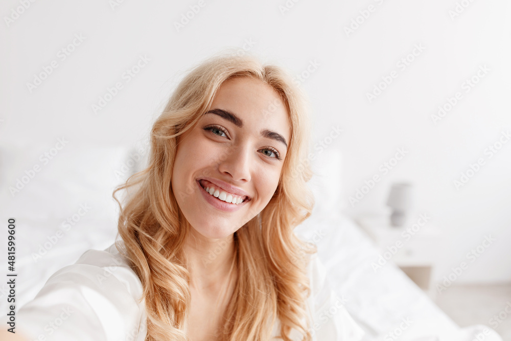 Positive emotions, blogger makes video stream at home on comfortable bed Positive emotions, blogger makes video stream at home on comfortable bed