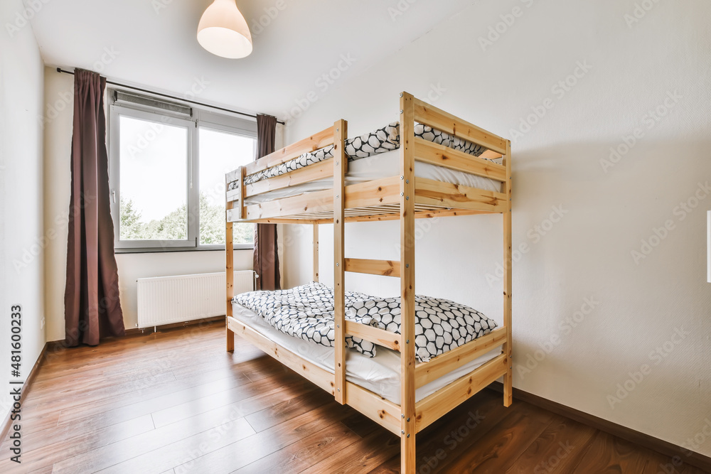 Lovely bedroom with wooden bunk bed and chandelier - obrazy, fototapety, plakaty 