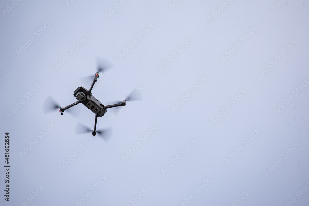 the quadcopter flies high in the sky and shoots the quadcopter flies high in the sky and shoots