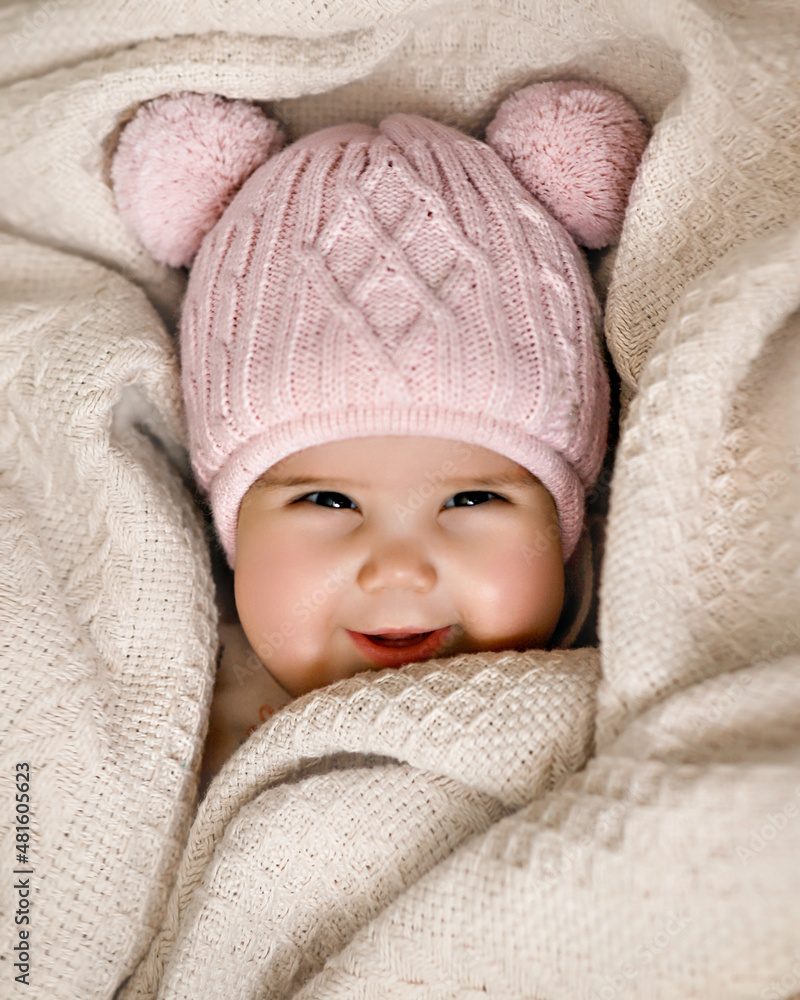 smiling baby in a hat and blanket smiling baby in a hat and blanket