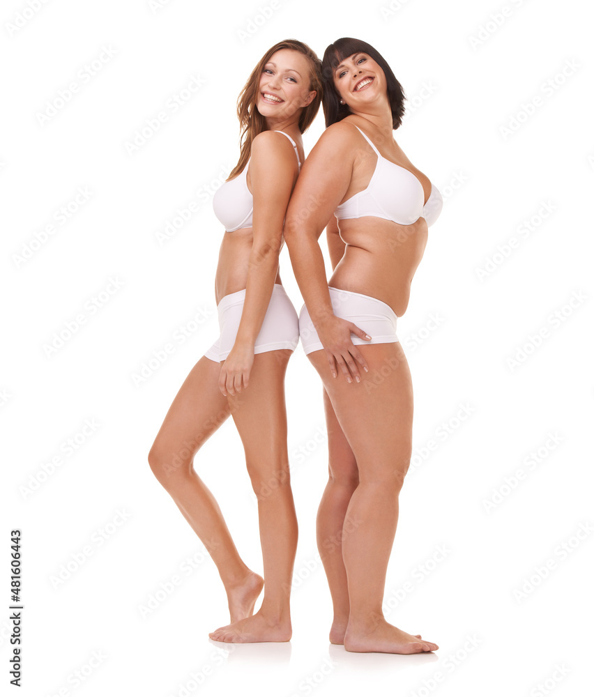 Just happy being themselves. Two women of different body shapes standing together back to back while isolated on white. Just happy being themselves. Two women of different body shapes standing together back to back while isolated on white.