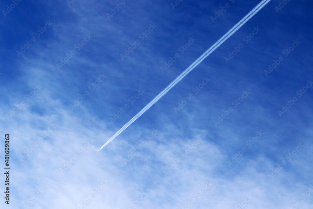 Trace of the high flying plane on the blue sky with white clouds.. Trace of the high flying plane on the blue sky with white clouds..
