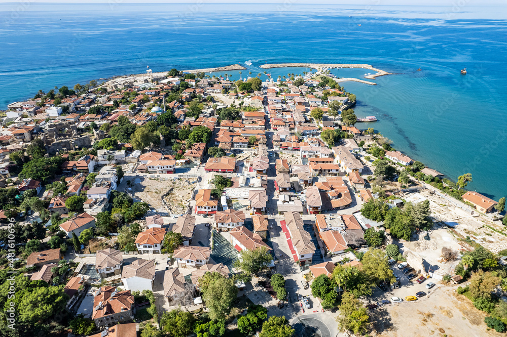 Naklejka premium Aerial drone View Of Side Antique City . Side Old Town amphitheater. Side Harbor marina in Antalya Turkey drone photo view