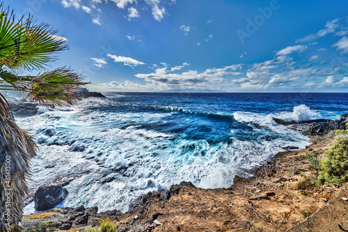 the Tenerife beach with clouds and sun , wide angle view of the sea. © the_lightwriter