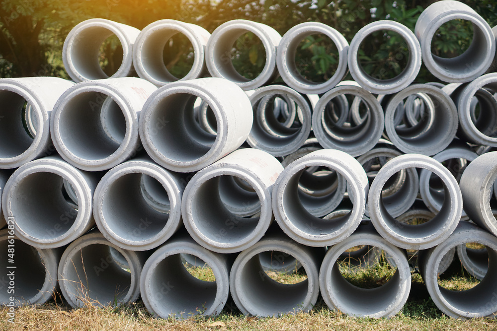 Drainage Cement pipes for construction placed outdoor. Concept : Industry manufacturing of cement products in Thailand. Drainage Cement pipes for construction placed outdoor. Concept : Industry manufacturing of cement products in Thailand.