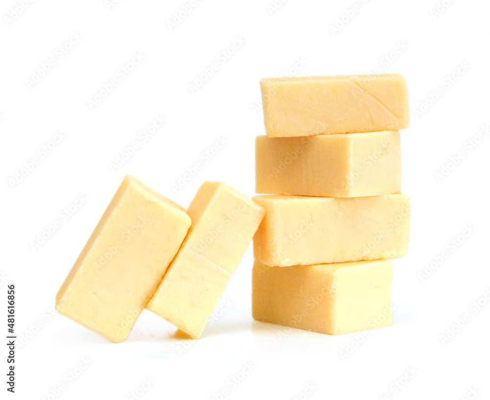 Cubes of cheddar cheese isolated on white Cubes of cheddar cheese isolated on white