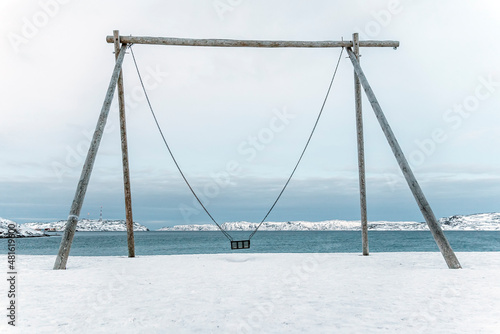 Fotografering Swings on the coast of Arctic ocean, the Kola Peninsula, Teriberka, Russia