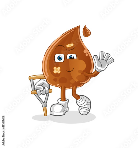 chocolate drop sick with limping stick. cartoon mascot vector